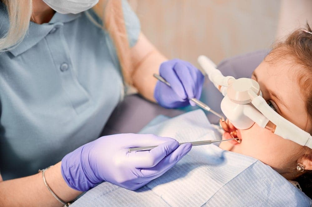 Relaxed patient in a dental chair under sedation dentistry