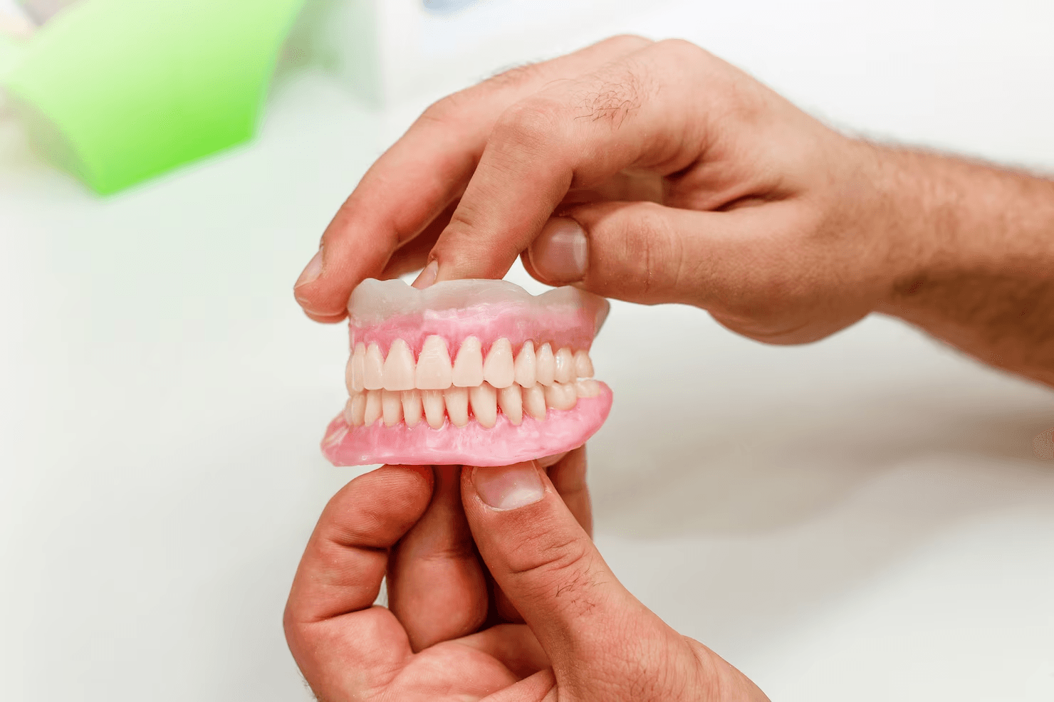 Different types of hybrid dentures displayed in a UK dental practice