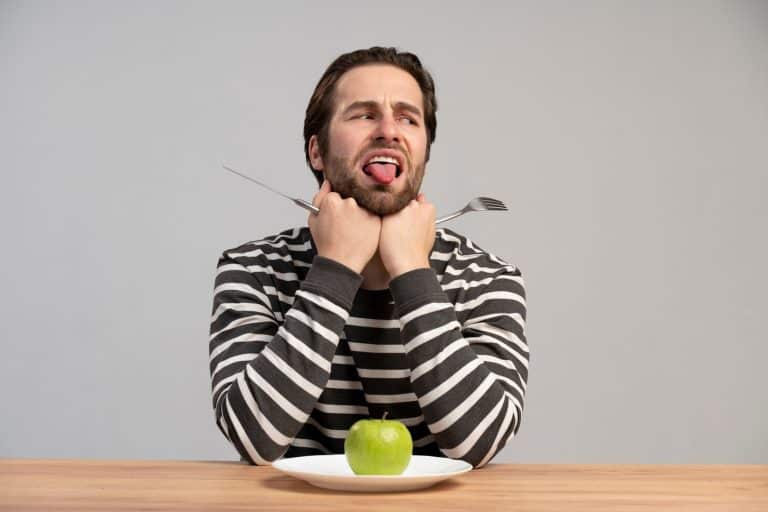 Person experiencing metallic taste in mouth