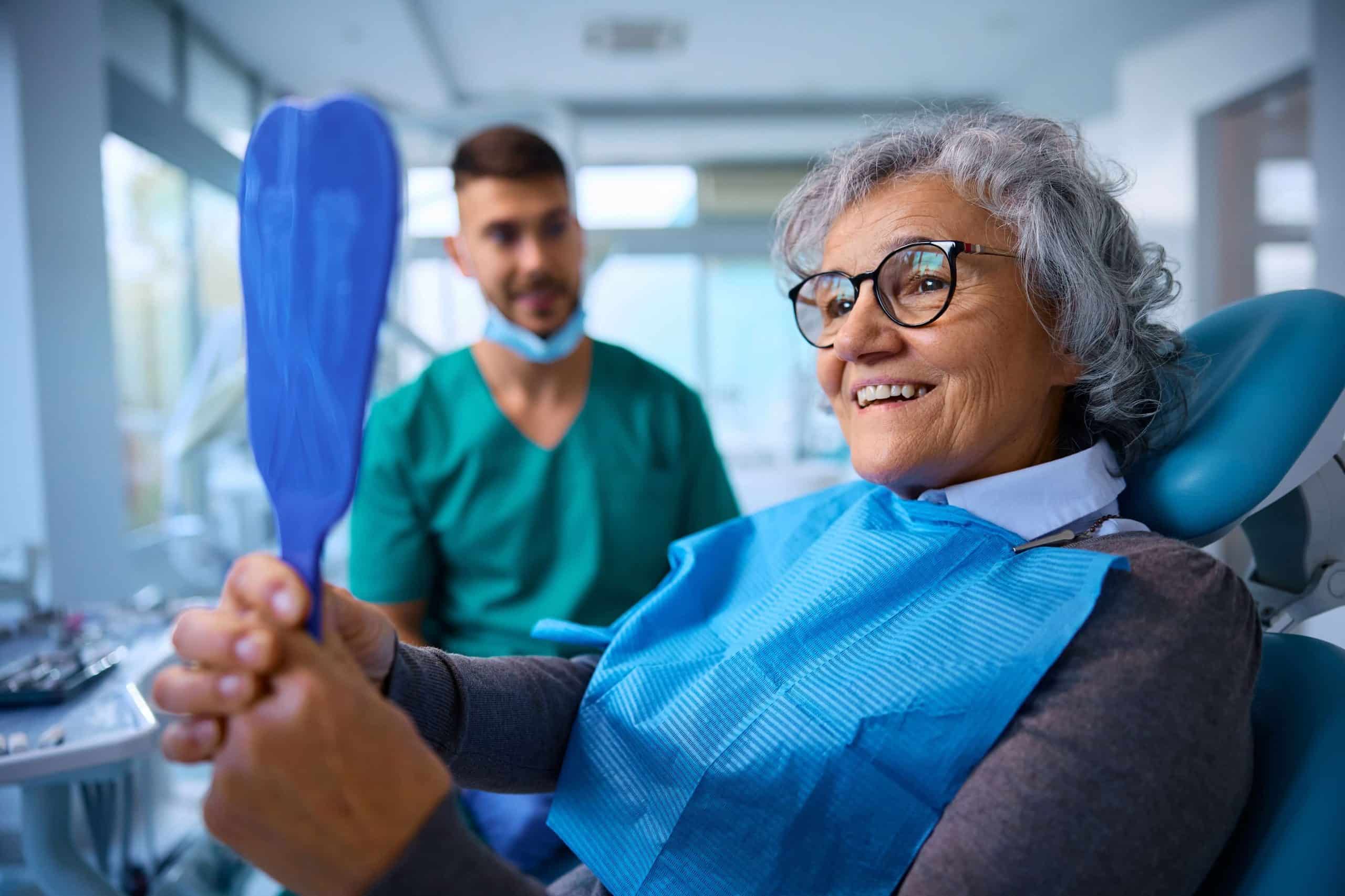 Dentist examining a patient's gums for signs of periodontal disease