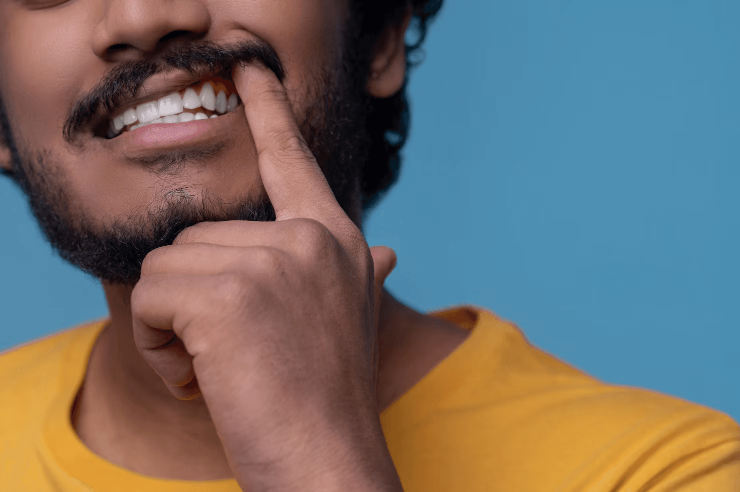 Person brushing teeth properly to reduce gum redness