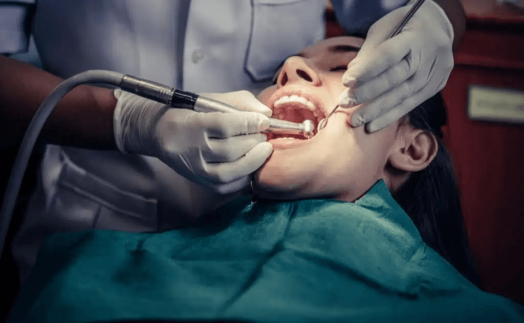 Dentist performing a dental procedure to treat a loose tooth