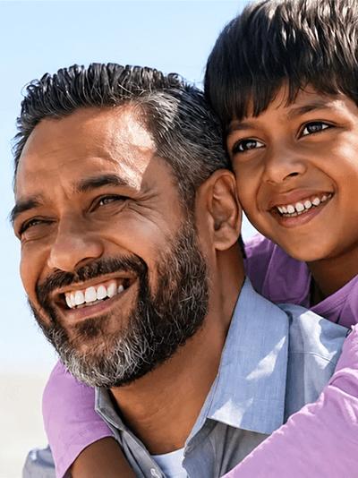 Father and daughter smiling together